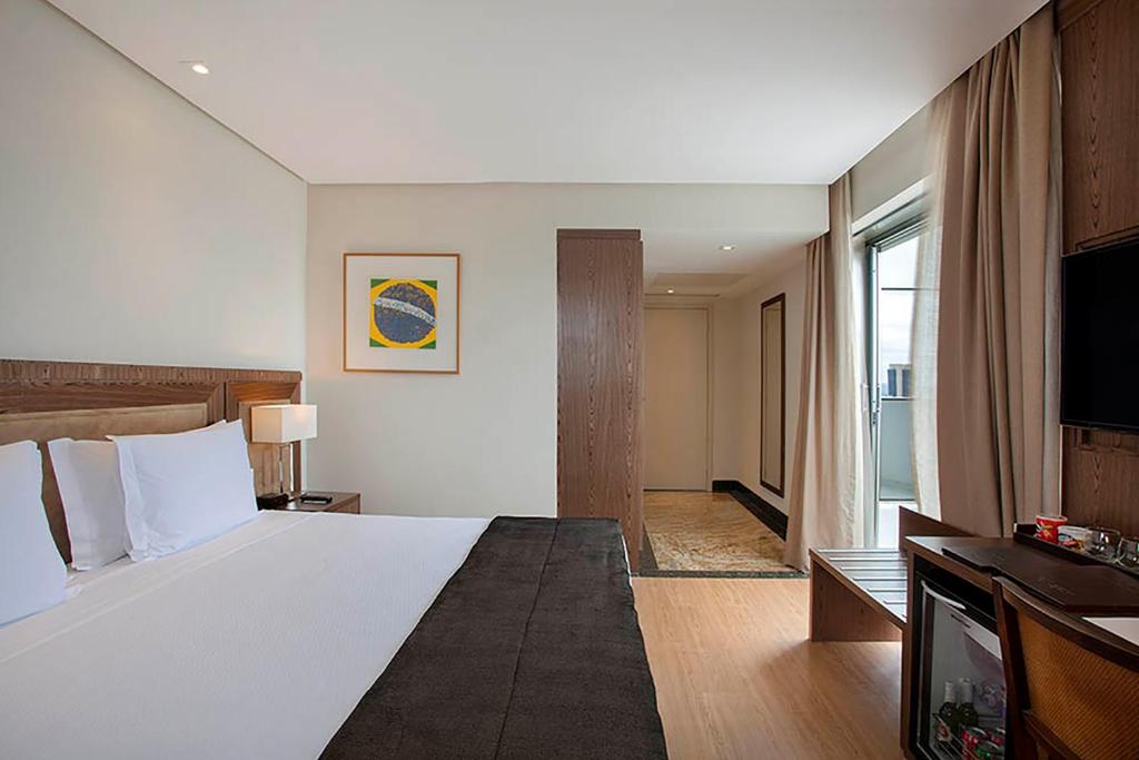 Postel nebo postele na pokoji v ubytování Windsor Brasilia Hotel