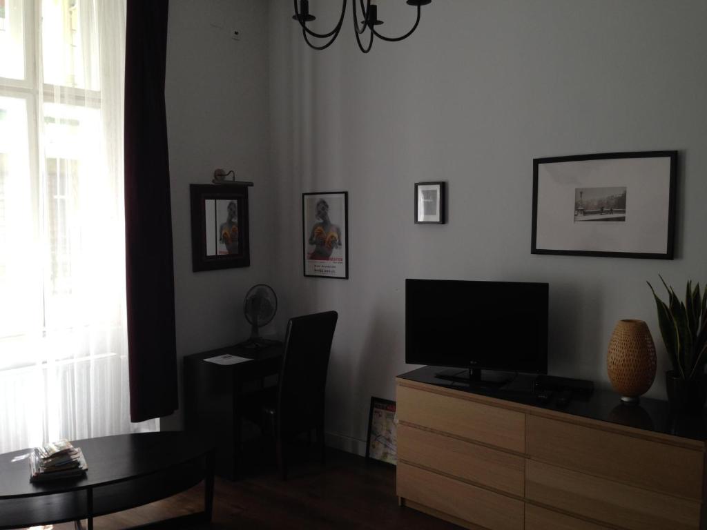 Televízia a/alebo spoločenská miestnosť v ubytovaní Private Apartment Centertown