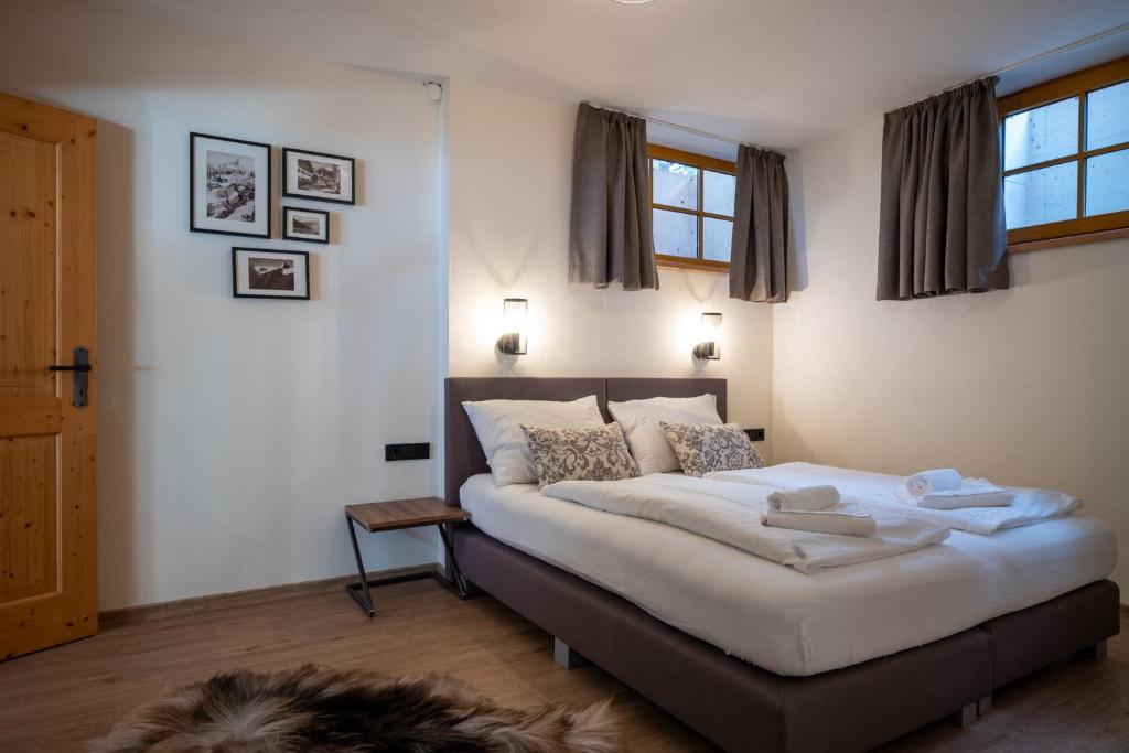 Postel nebo postele na pokoji v ubytování Landhaus Lodges Kaprun by we rent