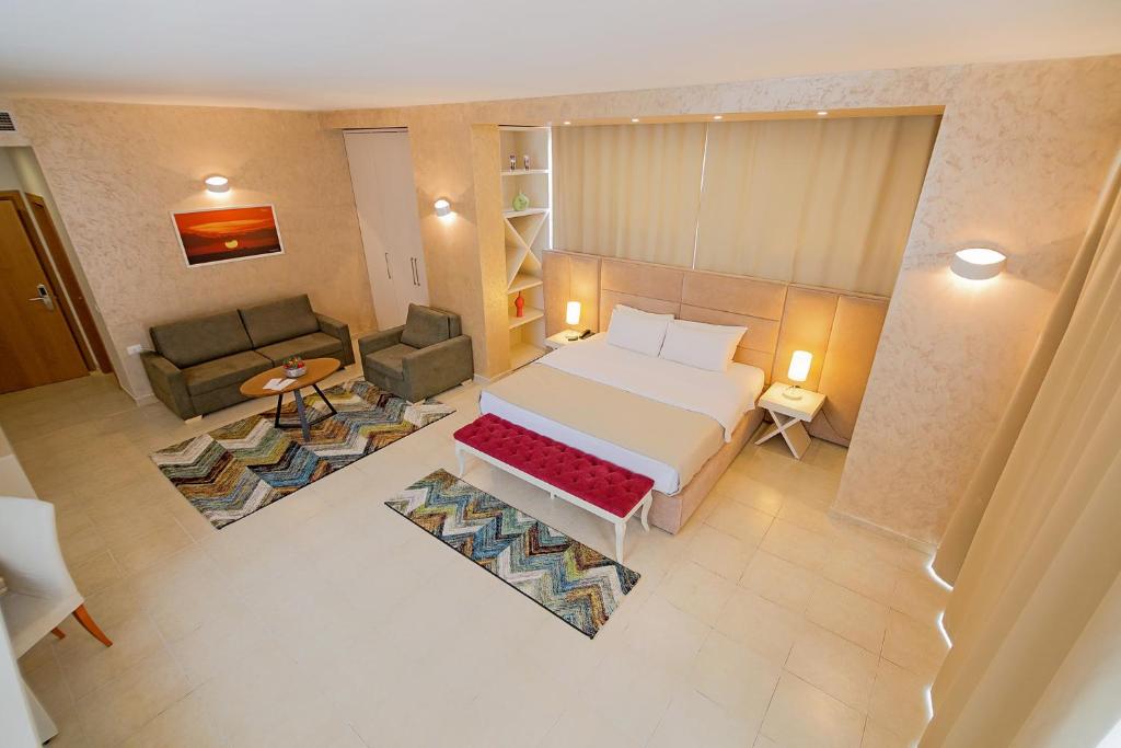 Postel nebo postele na pokoji v ubytování Horizont Hotel