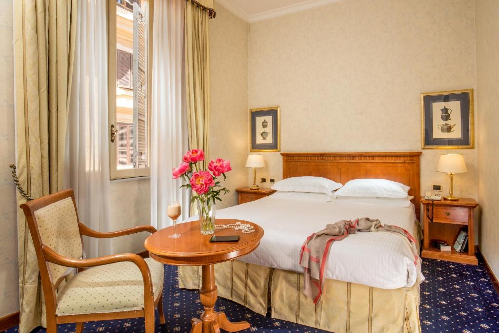 Postel nebo postele na pokoji v ubytování UNA HOTELS Empire Roma