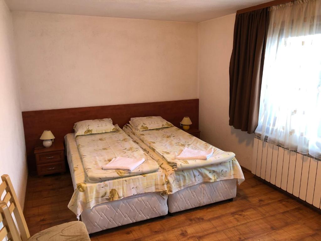 Postel nebo postele na pokoji v ubytování Guest Rooms Vachin