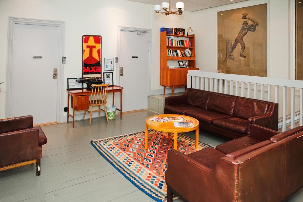 a living room with a couch and a table at City Backpackers Hostel in Stockholm
