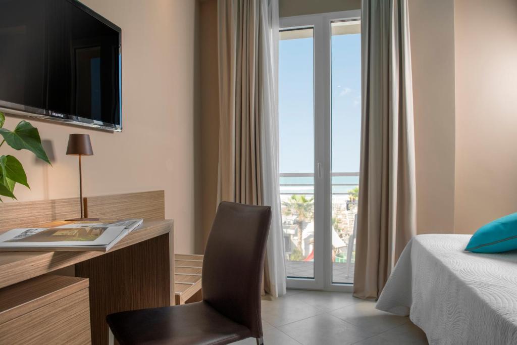 Postel nebo postele na pokoji v ubytování Hotel Adlon - FRONTE MARE
