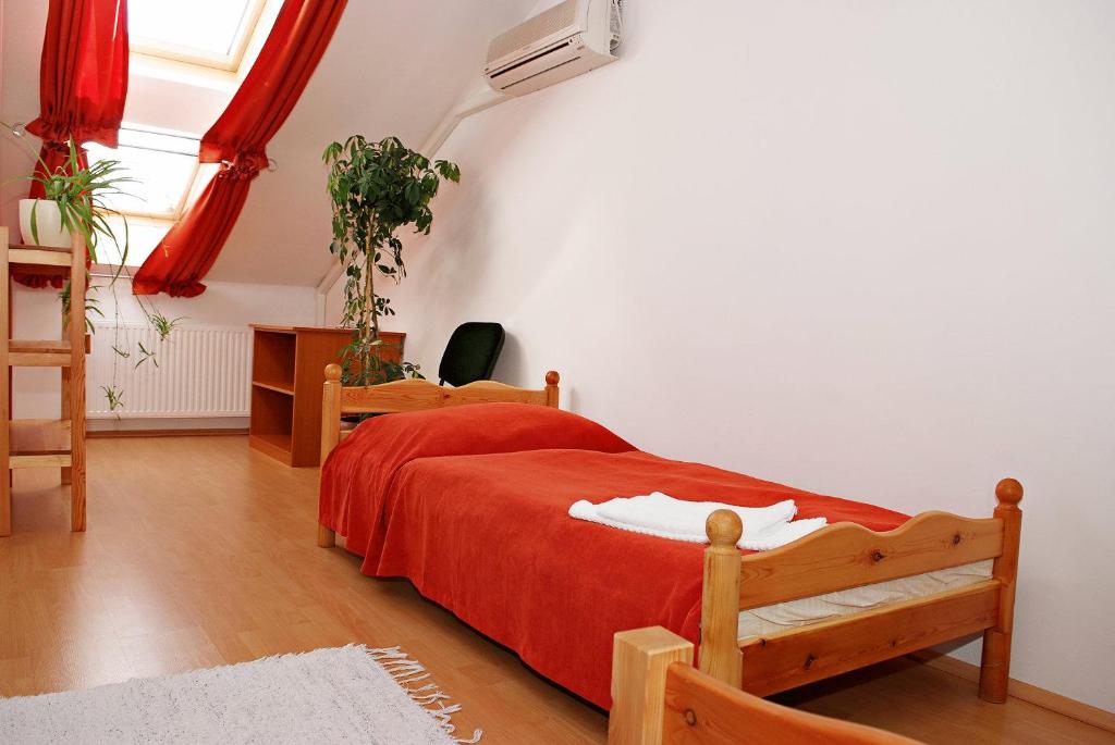 Posteľ alebo postele v izbe v ubytovaní Liszt Apartman