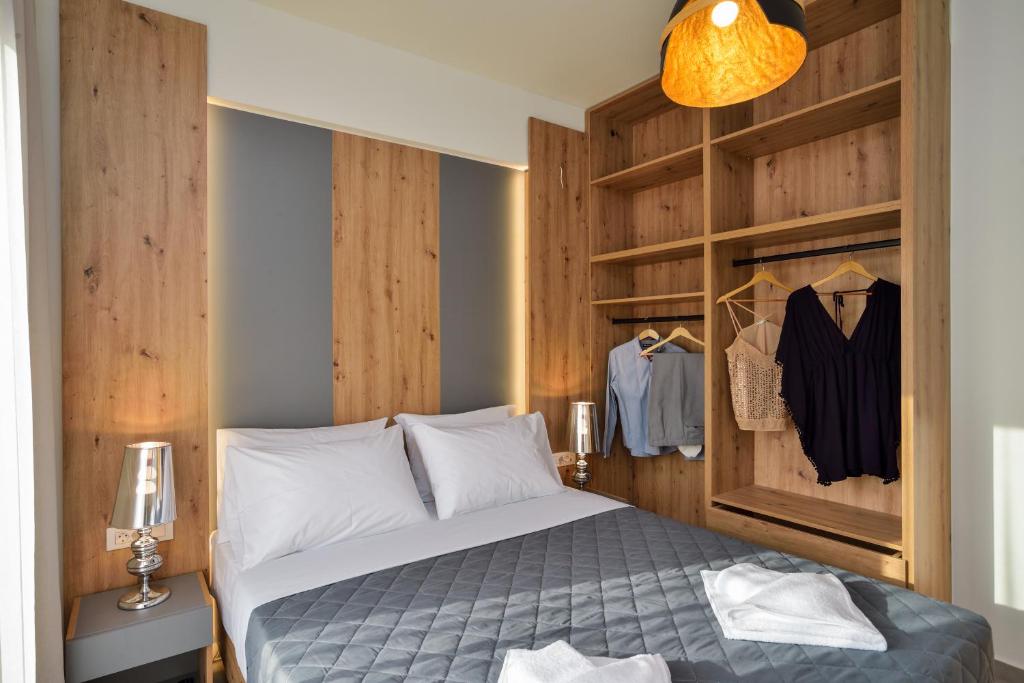 Łóżko lub łóżka w pokoju w obiekcie Elia Residences