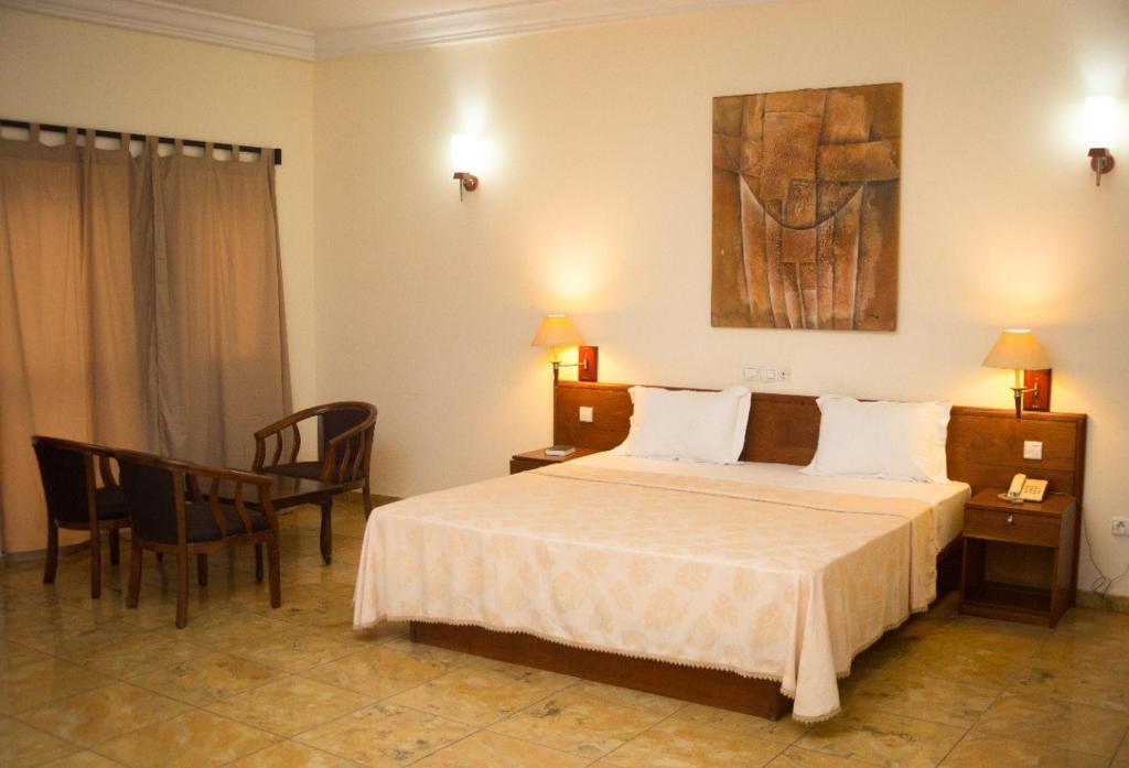 Postel nebo postele na pokoji v ubytování Hôtel Marbella
