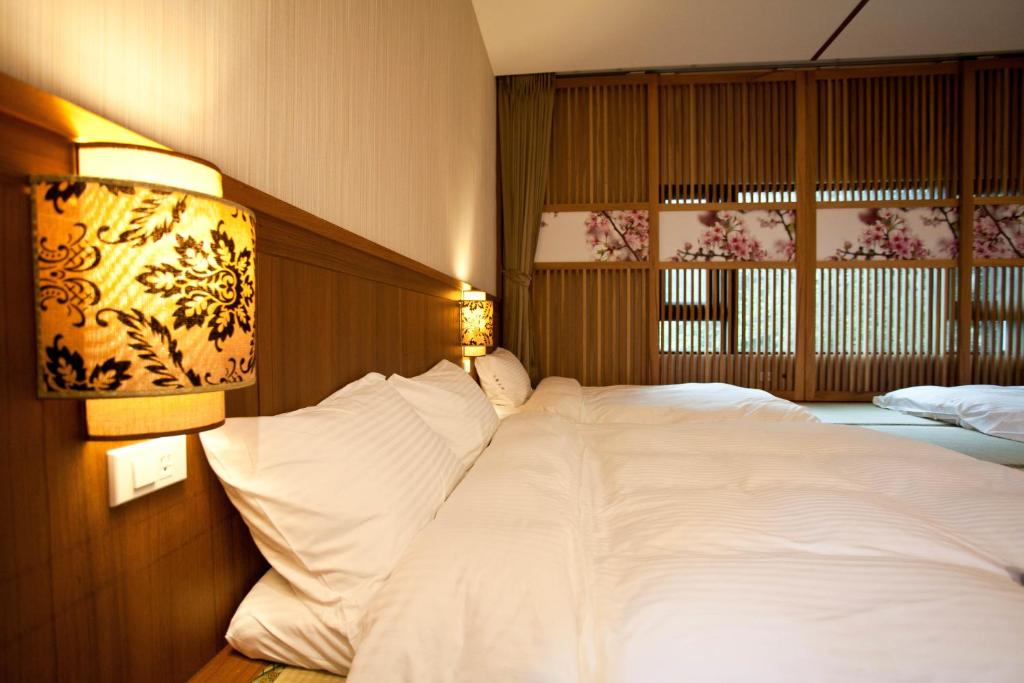 Voodi või voodid majutusasutuse Li Wu Zuo Cun B&B toas