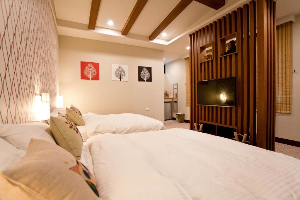 Voodi või voodid majutusasutuse Li Wu Zuo Cun B&B toas