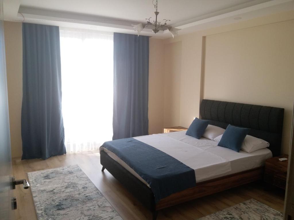 Postel nebo postele na pokoji v ubytování Çınar Residance