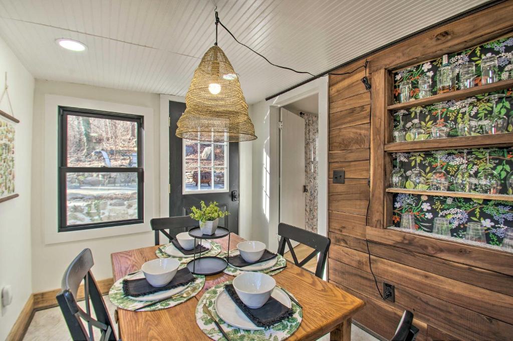 a dining room with a table and chairs and a chandelier at Nellysford Home about 10 Mi to Wintergreen Resort in Nellysford