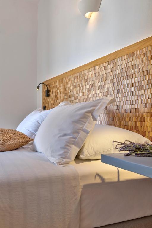Кровать или кровати в номере Calma Boutique Hotel
