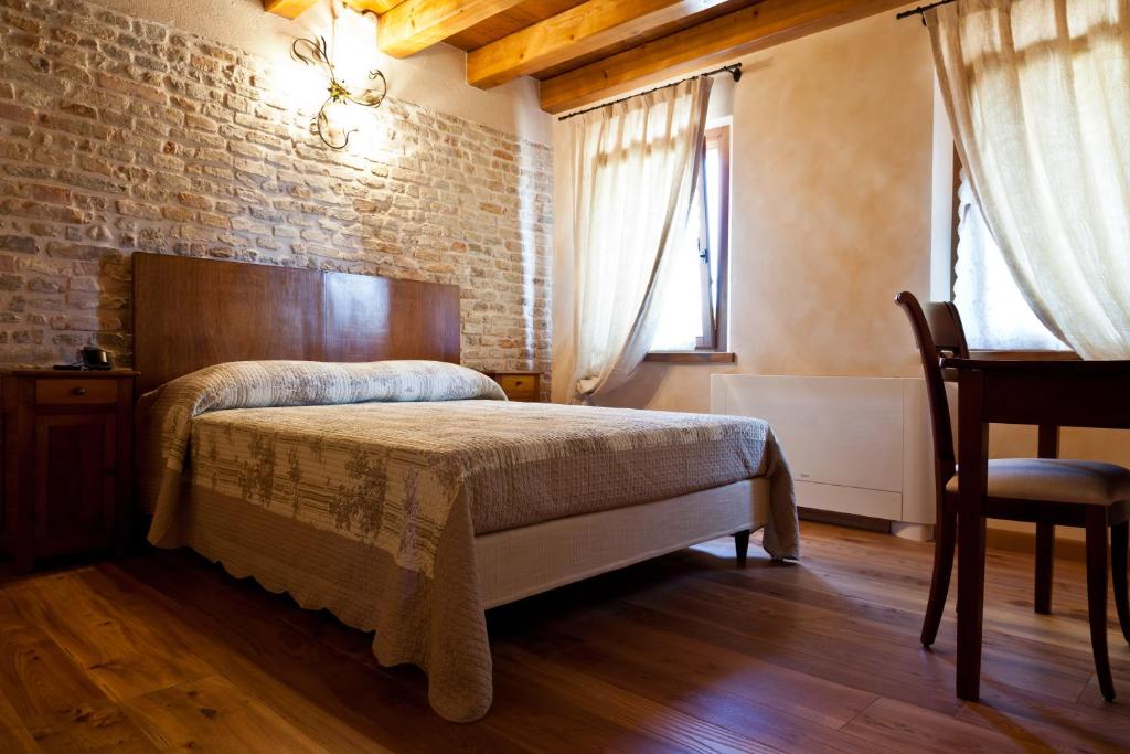 Postel nebo postele na pokoji v ubytování Ca' Muliner