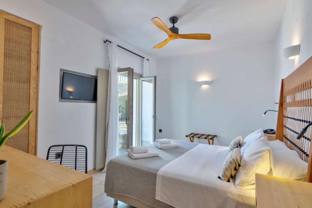 Кровать или кровати в номере Calma Boutique Hotel