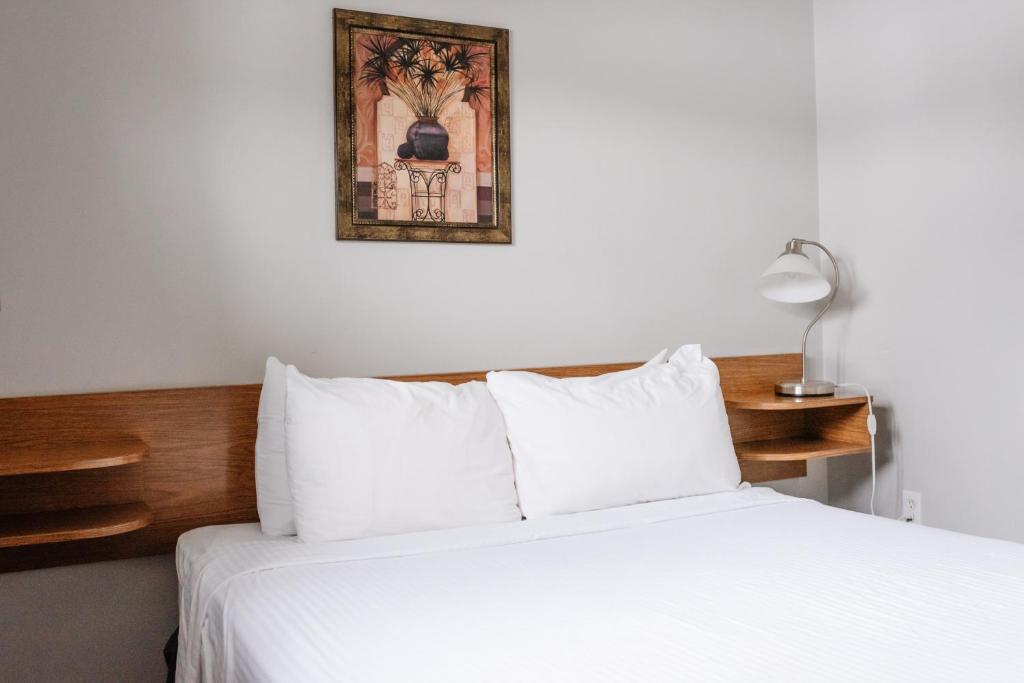 Postel nebo postele na pokoji v ubytování Paradise Motel