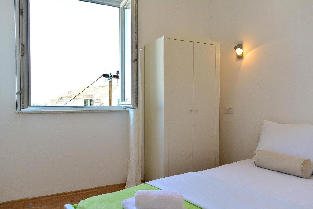 Postel nebo postele na pokoji v ubytování Golden B&B