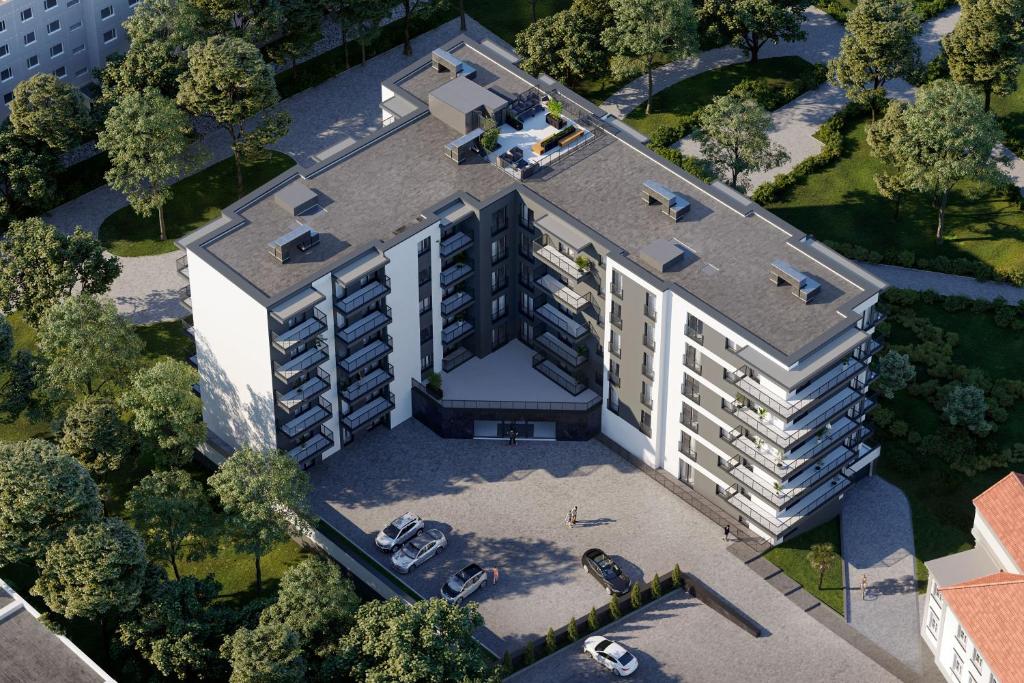 an overhead view of a building with a roof at APARTAMENTY PARK CITY in Ostrów Wielkopolski