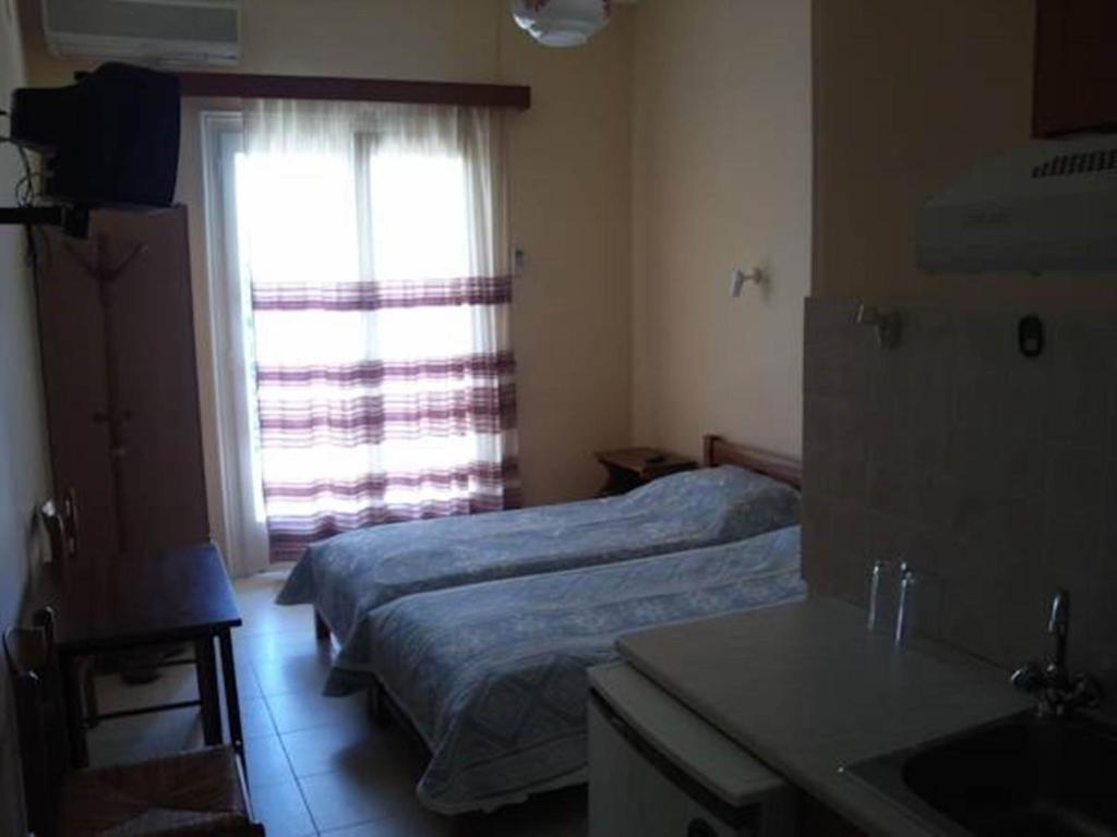 Postel nebo postele na pokoji v ubytování Foivos