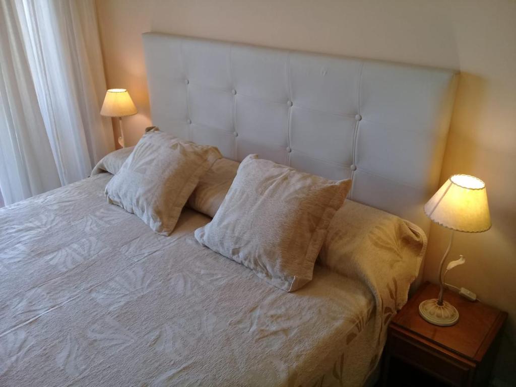 En eller flere senge i et værelse på Acuario 7