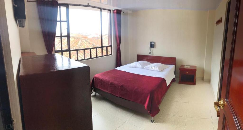 Postel nebo postele na pokoji v ubytování Hotel Vigua
