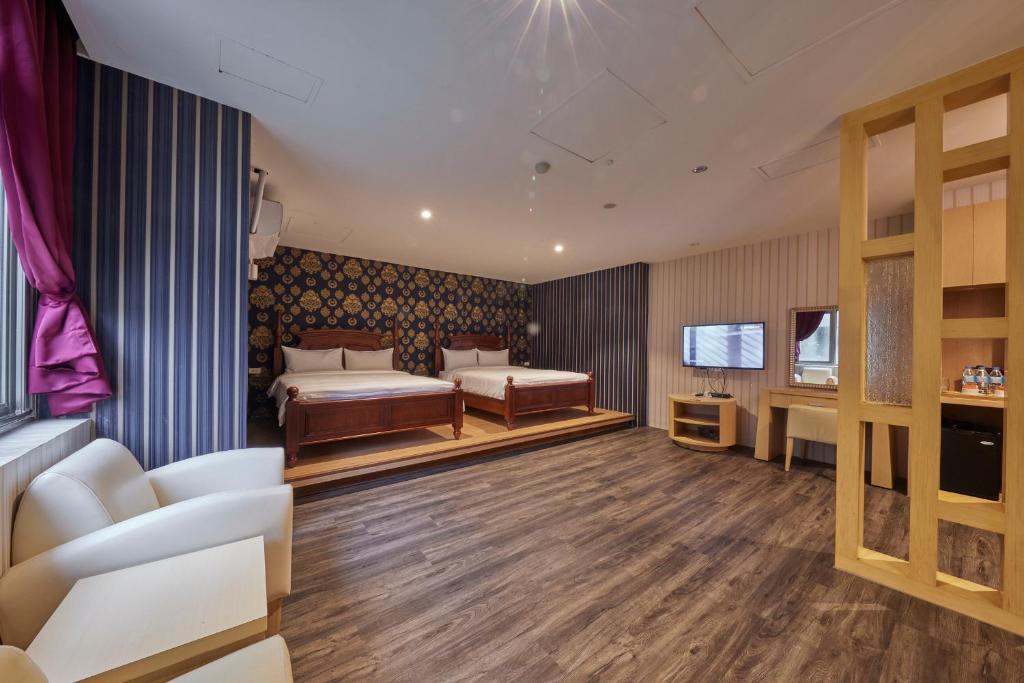 Postel nebo postele na pokoji v ubytování Kyokusui Hotspring Hotel