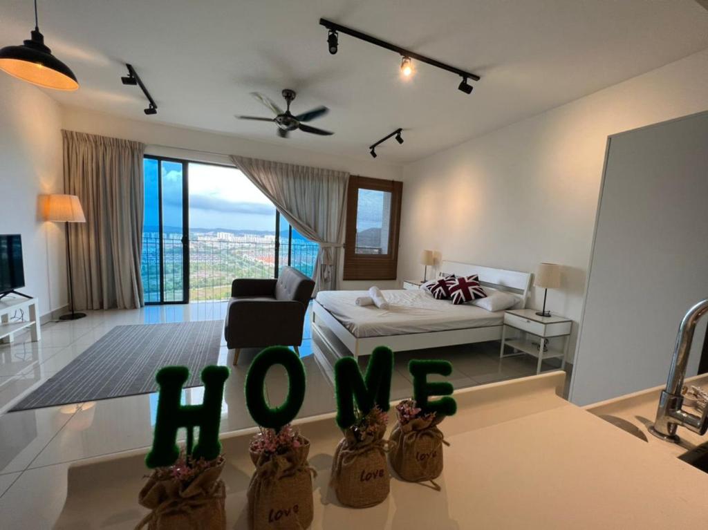 a living room with a bed and a sign that says love at Francesco Suite - Trefoil Setia Alam-Near Setia City Mall & Setia Convention Centre in Setia Alam