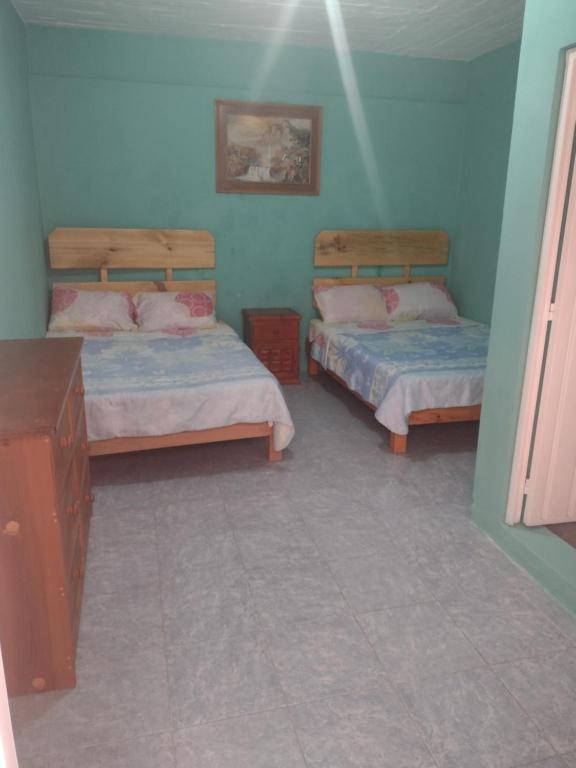 Cama o camas de una habitación en Hostal Eclipse Oaxaca