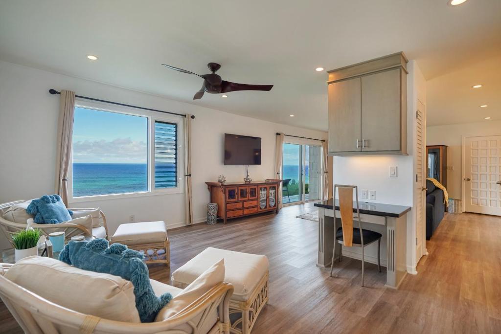 a kitchen and living room with a view of the ocean at Alii Kai Resort #5102 in Princeville