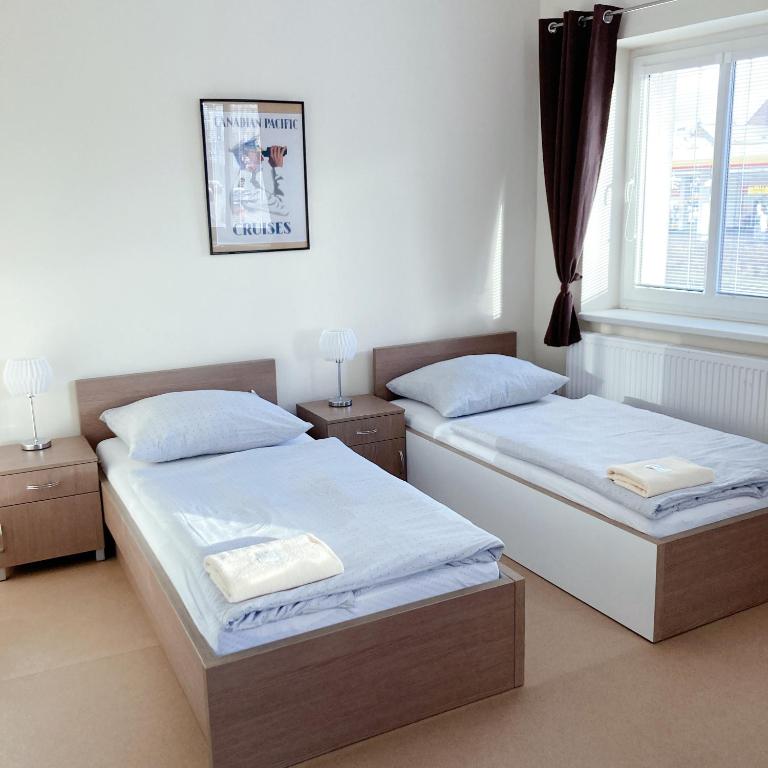Postel nebo postele na pokoji v ubytování Hotel U námořníka