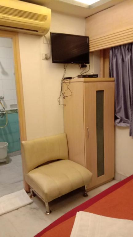 TV a/nebo společenská místnost v ubytování Hotel Aston