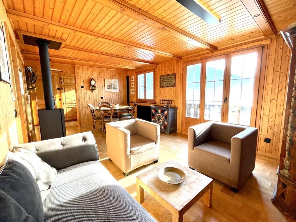 a living room with a couch and chairs and a table at Top location near Rapperswil 
