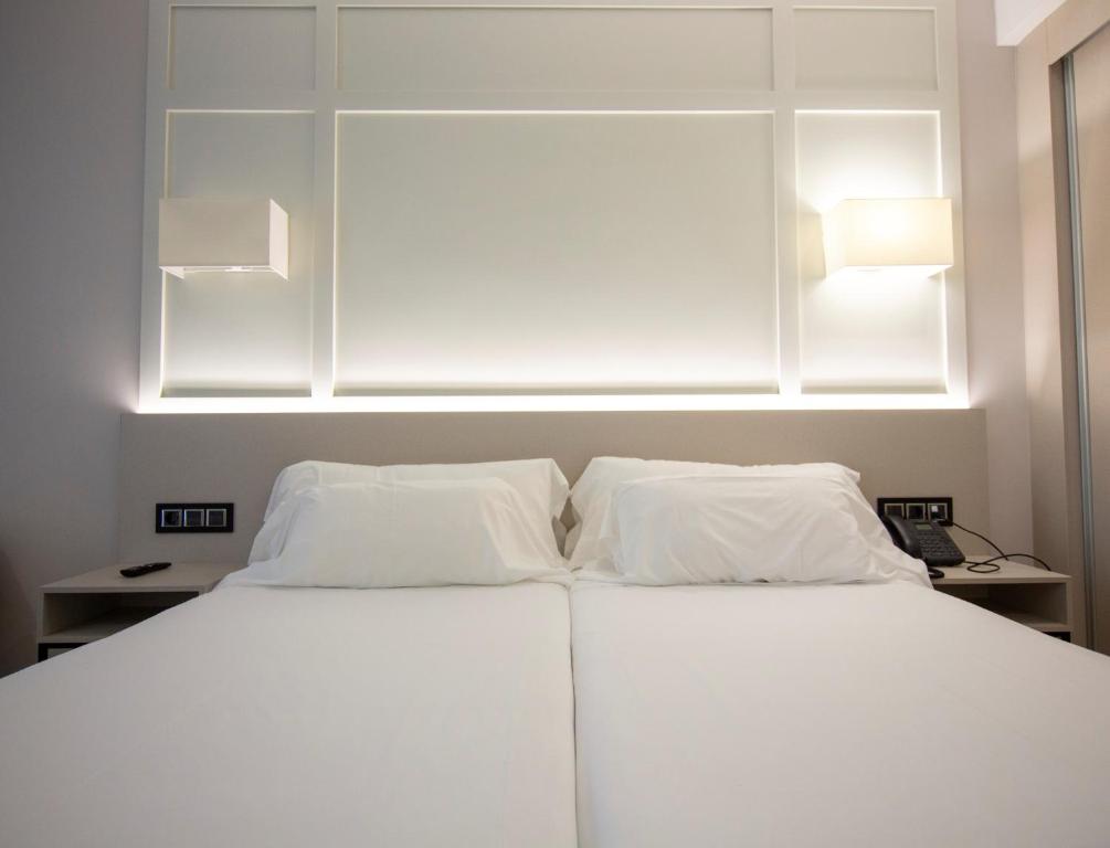 Cama o camas de una habitación en Oca Playa de Foz Hotel & Spa