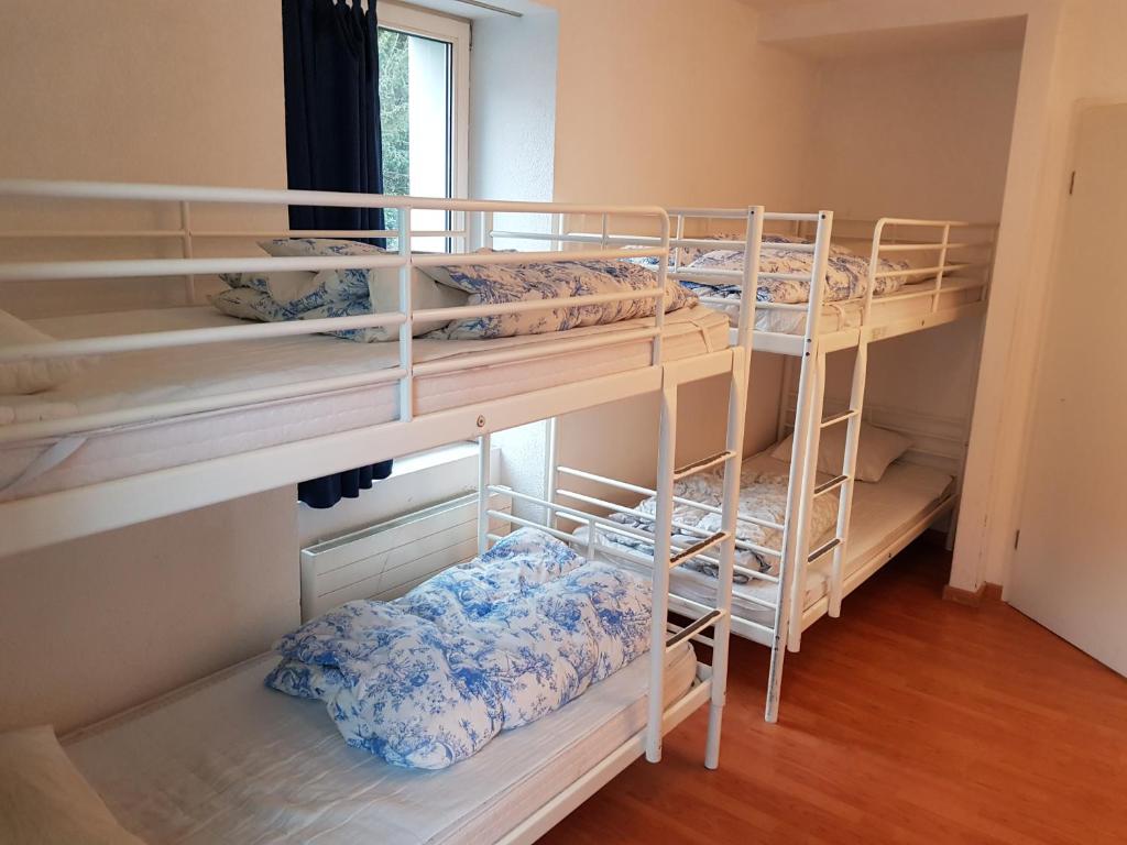 Postel nebo postele na pokoji v ubytování Bellpark Hostel