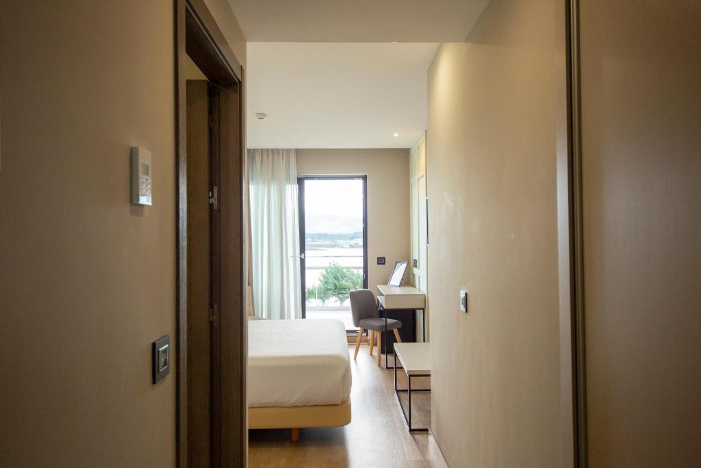 Cama o camas de una habitación en Oca Playa de Foz Hotel & Spa
