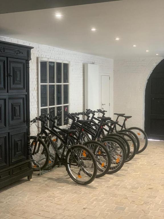 a bunch of bikes parked in a room at Little Farm Comfort&amp;PrestigeHouse in Ittre