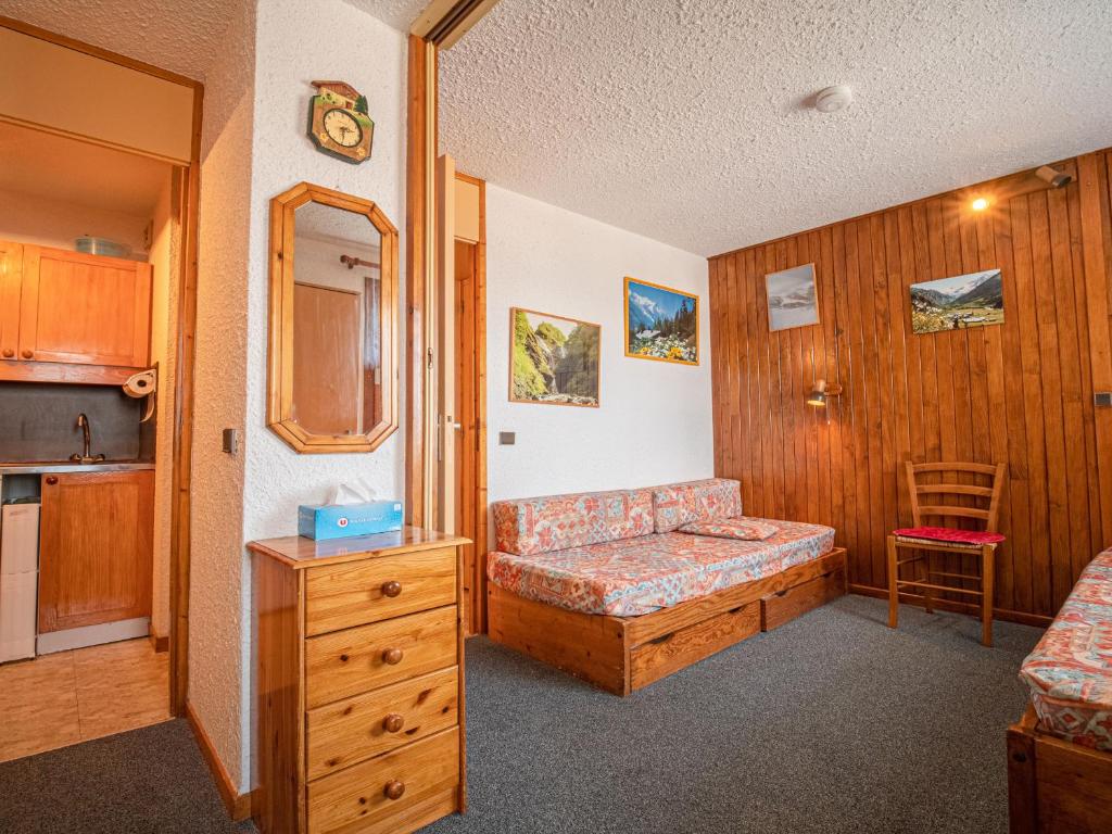a room with a bed and a couch in a room at Appartement Valmorel, 1 pièce, 4 personnes - FR-1-356-291 in Valmorel