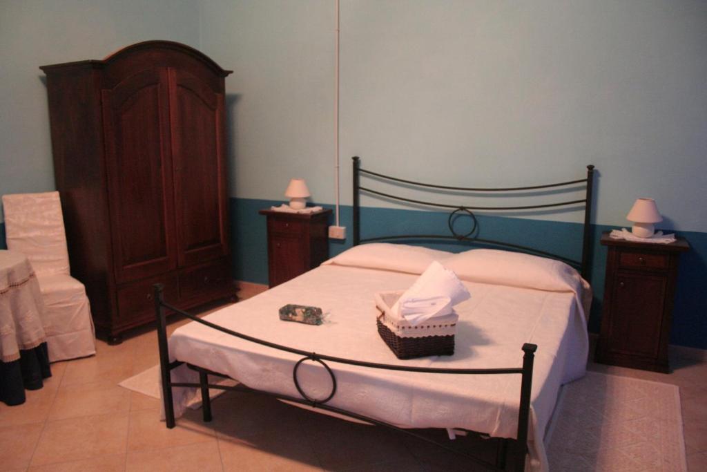 Postel nebo postele na pokoji v ubytování B&B Su Maimoni