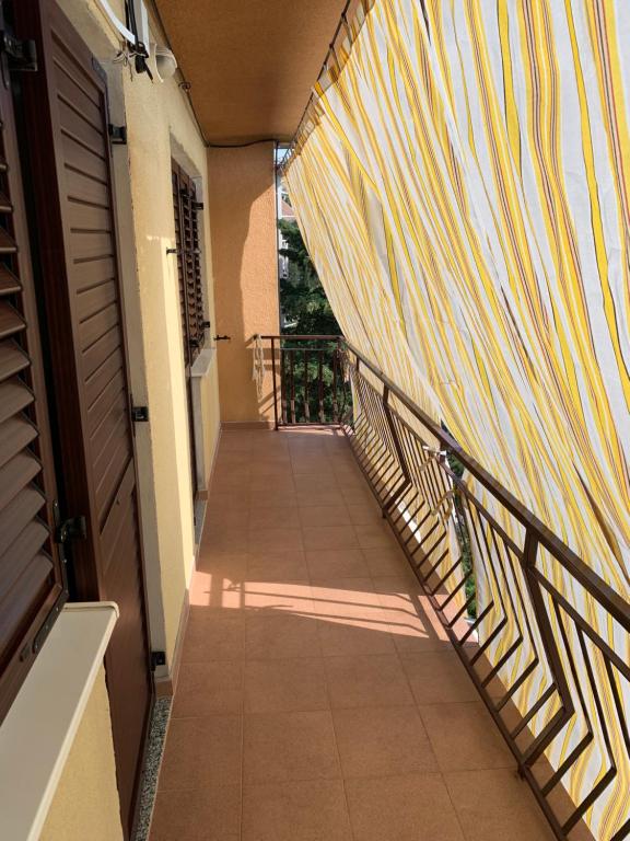 a hallway of a house with a striped wall at Apartment Ivanka in Senj