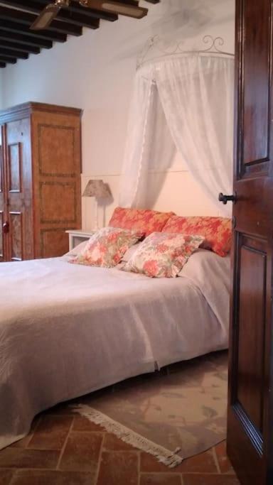 Postel nebo postele na pokoji v ubytování Villa Pianelli