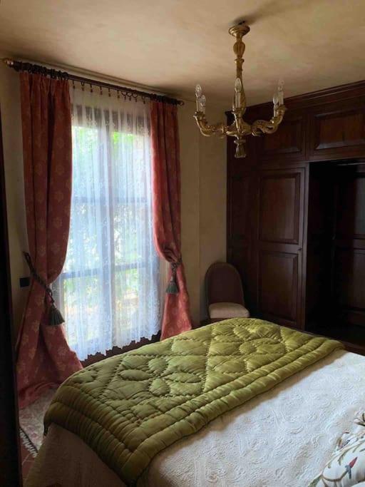 Postel nebo postele na pokoji v ubytování Villa Pianelli