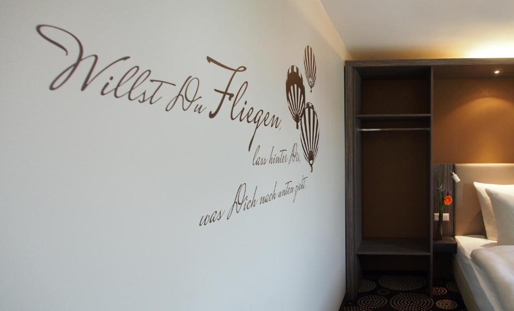 Postel nebo postele na pokoji v ubytování Myhotel