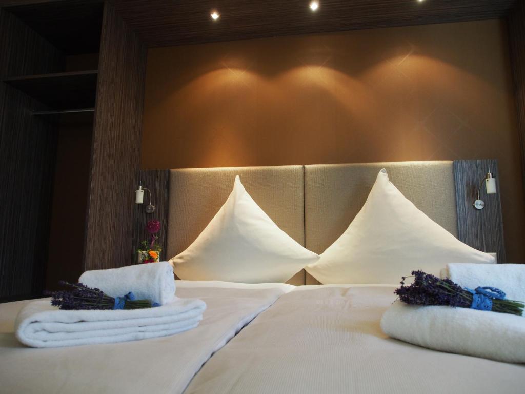 מיטה או מיטות בחדר ב-Myhotel