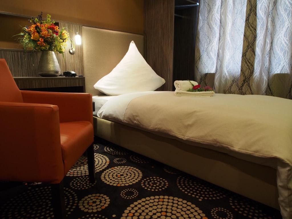 Postel nebo postele na pokoji v ubytování Myhotel