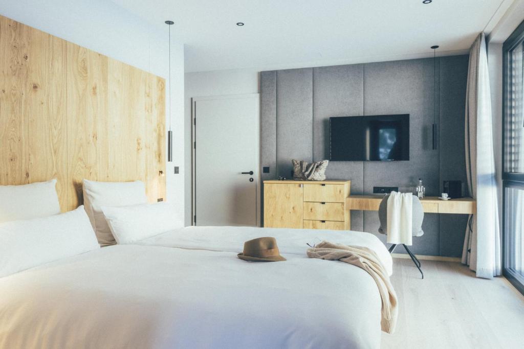 Postel nebo postele na pokoji v ubytování DAS GERLOS - Boutique Hotel