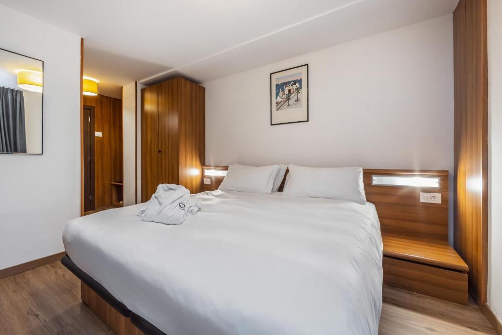 Postel nebo postele na pokoji v ubytování Luna Wellness Hotel