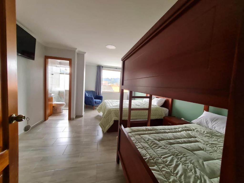 Postel nebo postele na pokoji v ubytování Hostal Morlaquita