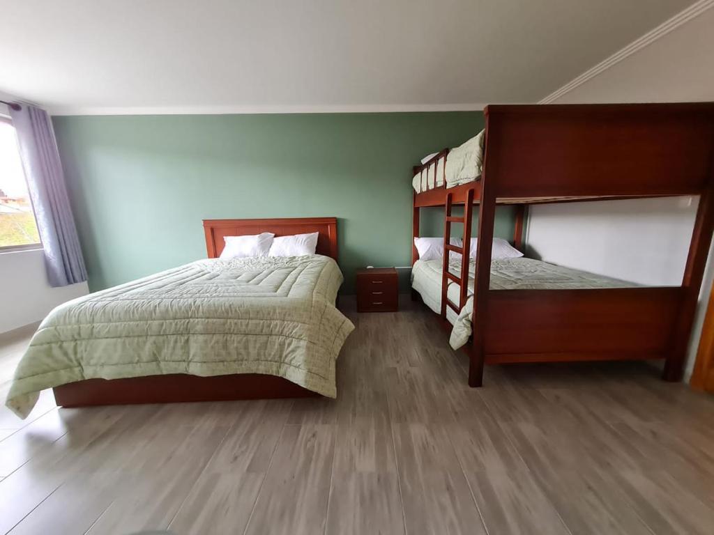Postel nebo postele na pokoji v ubytování Hostal Morlaquita