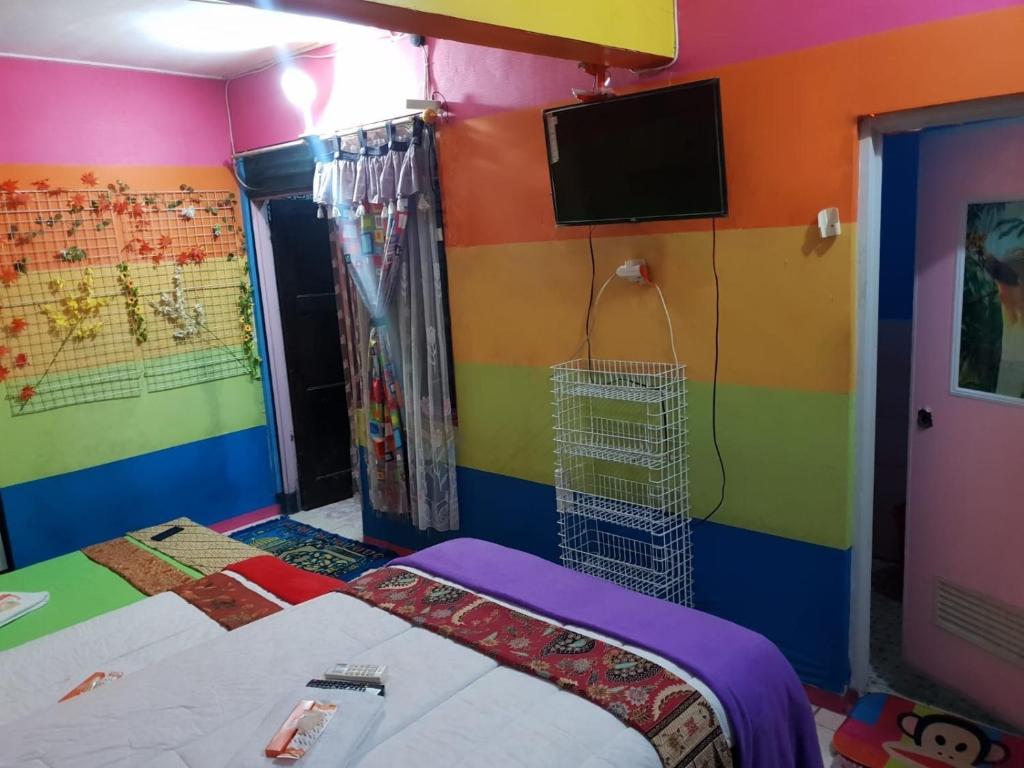 Postel nebo postele na pokoji v ubytování Pelemkecut Double-Degree Syariah Accommodation