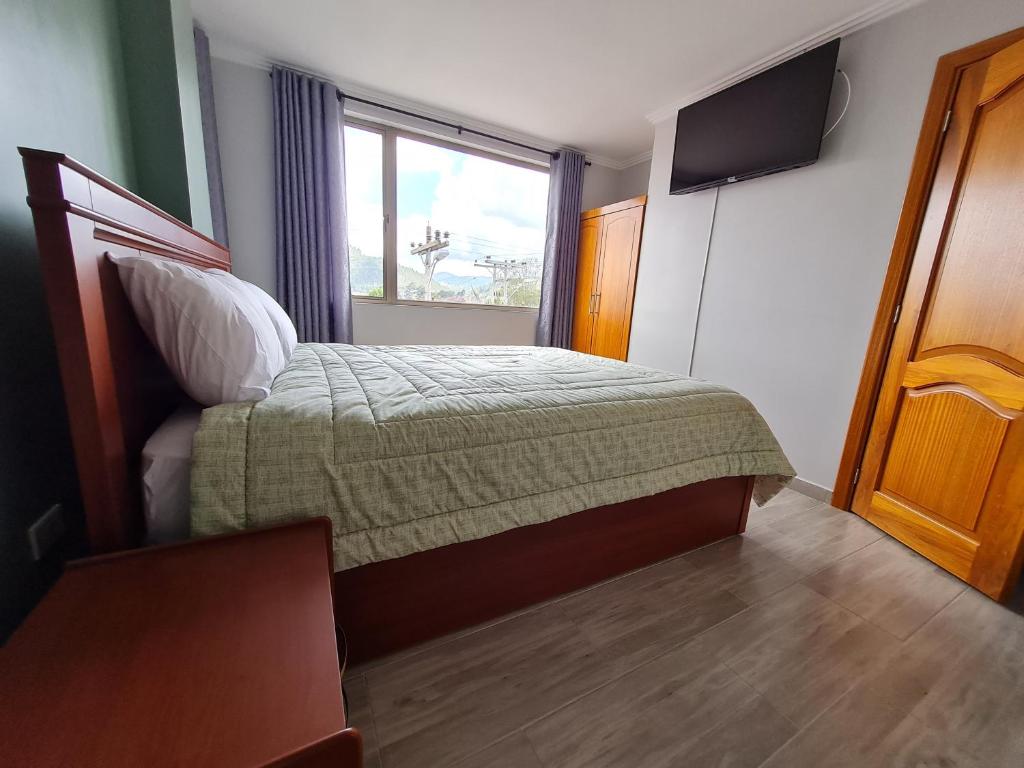 Postel nebo postele na pokoji v ubytování Hostal Morlaquita