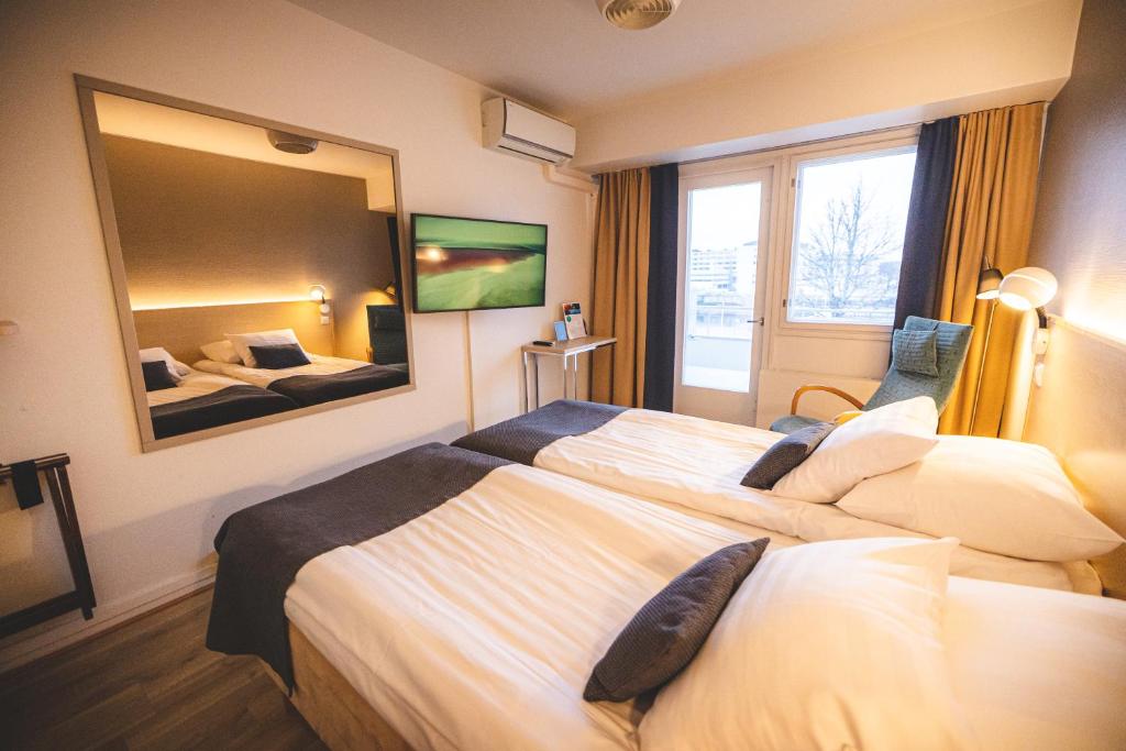 Postel nebo postele na pokoji v ubytování Spahotel Casino